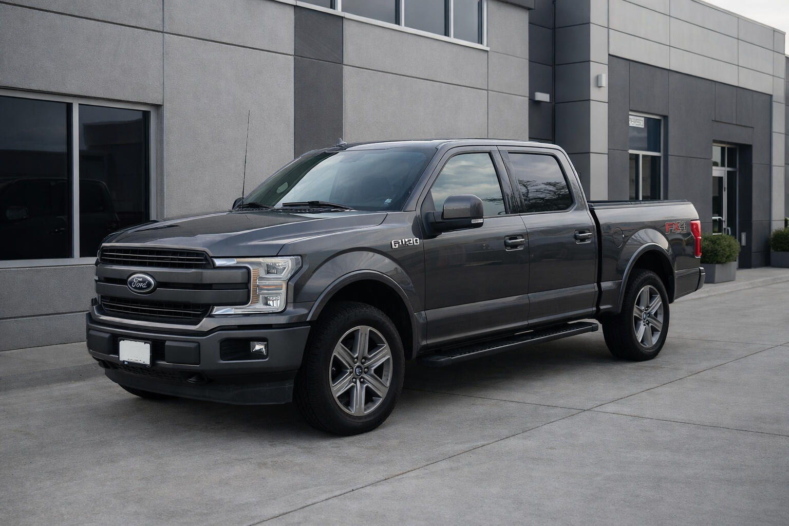 Hero Picture Hero Picture of a standard delivery van near a business office setting.